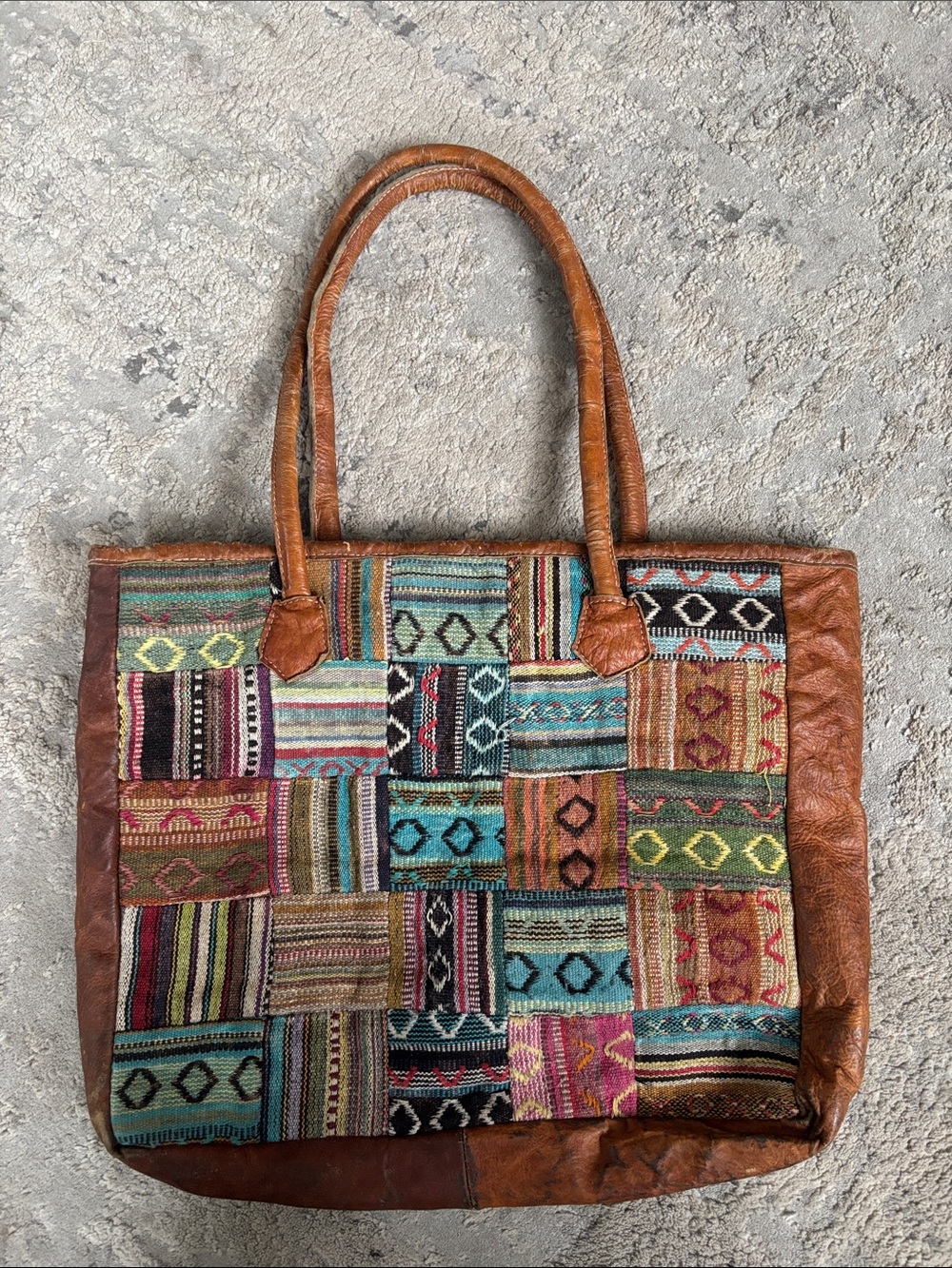 Bohemian Patchwork Tote Bag with Brown Leather Trim has lots of wear